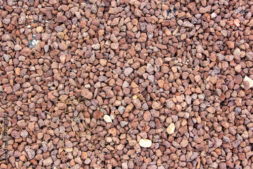 Background of stone pebbles. Texture of stone pebbles. Abstract background and texture for design. Gravel ground texture background, close up of gravel in the garden