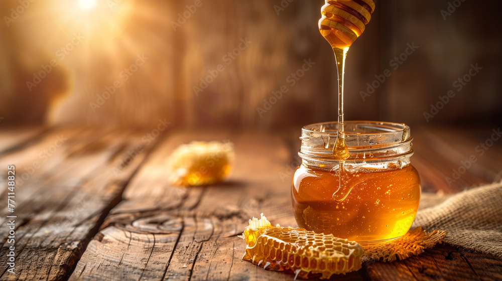 Honey and honeycomb on a wooden background, a jar of natural organic honey with a stick dripping from it in a closeup, jar of honey with honeycom, Glass bowl of honey with honey dipper isolated. - obrazy, fototapety, plakaty 