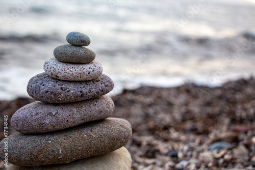 Canvas Print Stack of zen stones on the beach