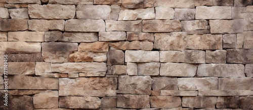 A detailed closeup of a natural building material, brickwork on a rectangular stone wall displaying the composite material made of bricks and rocks
