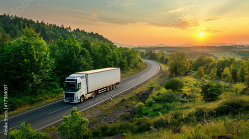 A powerful semi truck navigates a rural road with lush greenery and a vast blue sky in the background