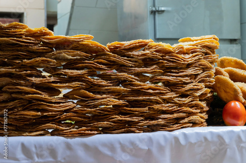 Khaja, an Indian deep-fried pastry, commonly filled with fruit or soaked with sugar syrup. Being sold at roadside, Jodhpur, Rajasthan, India.