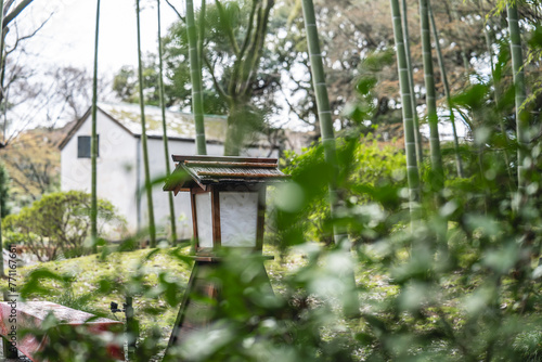 Картината върху платно Wooden lanterns from a bygone era in a wooded area in Japan.