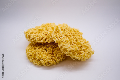 Unprepared asian instant noodles on white background