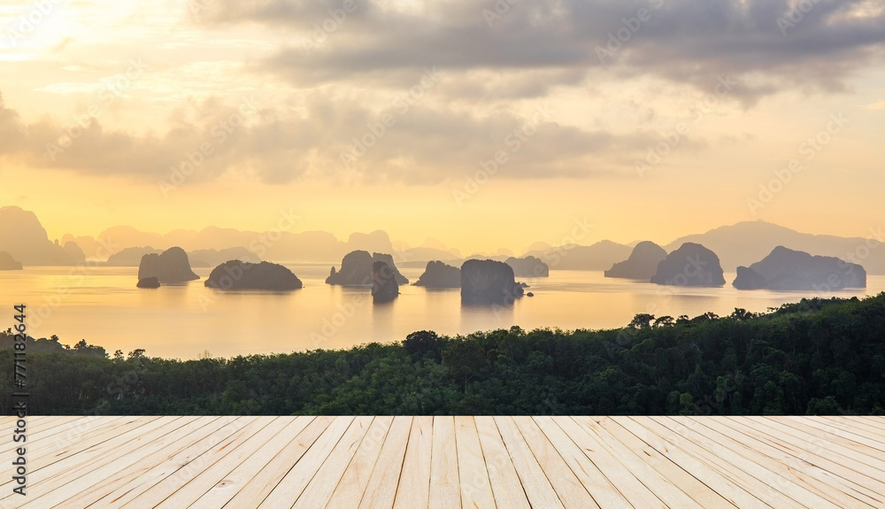 Fototapeta premium Wooden Floor with soft morning light tone sea with numerous islands at Phuket, Thailand