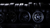 pile of wheel rims of various types on a dark background