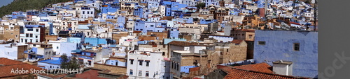 Panoramam of blue and white houses in a hill in the medina, in Chefchaouen, Morocco