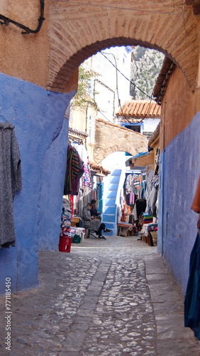 Souvenir shops along an alley in the medina, in Chefchaouen, Morocco © Angela