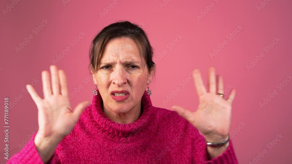 Serious adult woman motions no with hand in front. No means no concept clip. Serious adult woman motions no with hand in front. No means no concept clip.