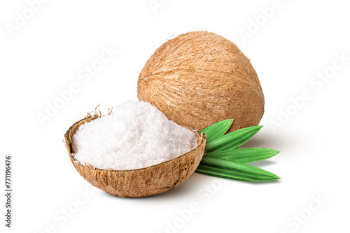 Coconut milk powder (shredded coconut, coconut flour) in coco nut shell isolated on white background