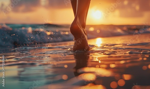 A closeup of the woman's feet walking on the beach at sunset