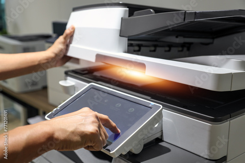 Hand use copier or photocopier or photocopy machine office equipment workplace for scanner or scanning document or printer for printing paperwork hard copy duplicate Xerox service maintenance repair.