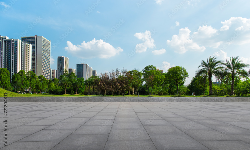 Outside the flat and vast square is a vast urban park, under a clear sky in summer Outside the flat and vast square is a vast urban park, under a clear sky in summer