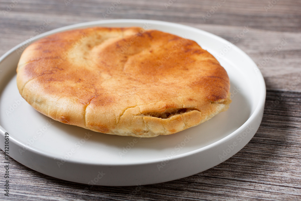 A closeup view of a whole hawawshi. A closeup view of a whole hawawshi.