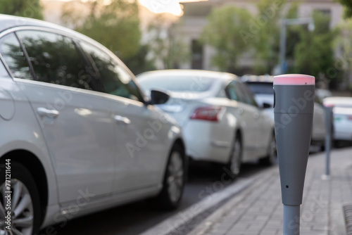 Modern intelligent parking timing and toll collection equipment, with cars parked on the roadside automatically sensing timing and toll collection