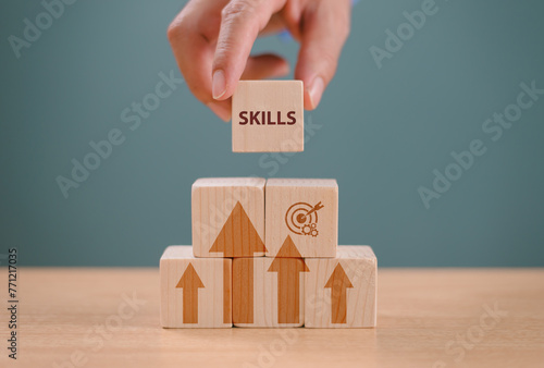 Skill development concept. Up new ability skill for technology evolution. Employee thinking, digital upskill. Hand hold wooden cube with digital skill icon. Skill training, education learning concept