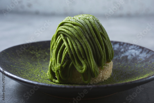 A closeup view of a matcha mont blanc cake.