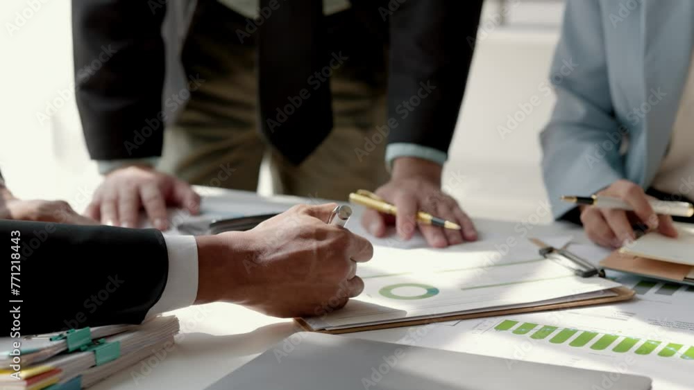 group of businesspeople is talking about data on the document on the table in the meeting room, employees are working together in the office on Monday morning group of businesspeople is talking about data on the document on the table in the meeting room, employees are working together in the office on Monday morning