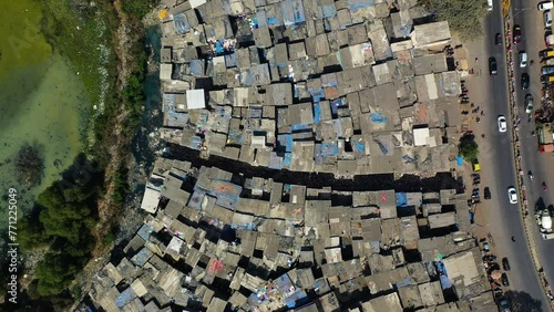 Filthy waterway, in middle of the Dharavi ghetto, in India - Top down drone shot