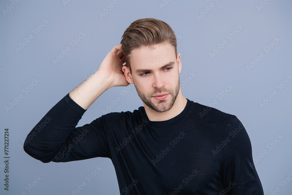 Skincare of men. Guy has stylish haircut. Man with trendy hairstyle. Casual male style. Young Caucasian man isolated on grey. Confident man face portrait. Men skin care. Suave and Handsome Skincare of men. Guy has stylish haircut. Man with trendy hairstyle. Casual male style. Young Caucasian man isolated on grey. Confident man face portrait. Men skin care. Suave and Handsome