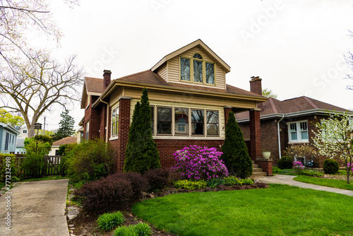 Architecture of suburban neighborhood. cottage house in american neighborhood. suburban house property. property insurance. residential house in america neighborhood. Landscape architecture