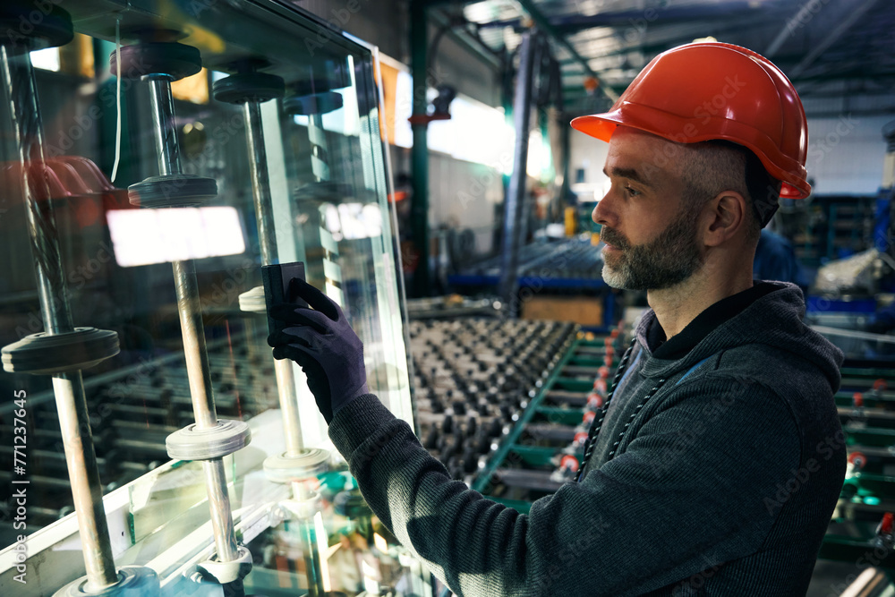 Employee uses special tools for working with glass Employee uses special tools for working with glass
