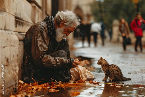 Homeless man on city street. Old sad man on cardboard in torn clothes hugging cat kitten seeking help, hungry poor person concept © Алина Троева