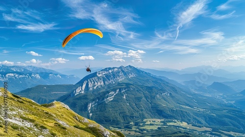 Paraglider flying over mountains with scenic views
