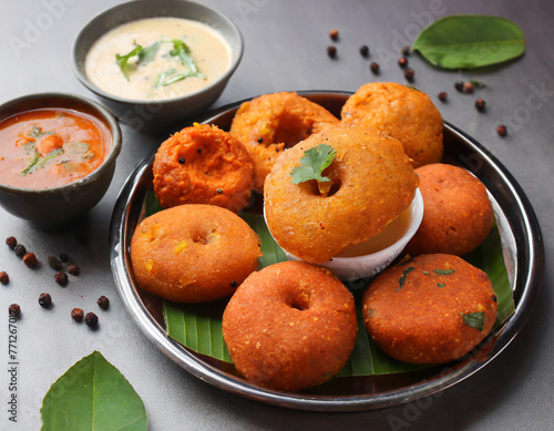 vada or medu vadai with sambar and chutney popular photo