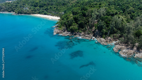 Aerial view banana beach white tropical beach with long-tail boat and palm tree in banana beach, Tropical beach with clear water at Banana beach, Phuket, Thailand.