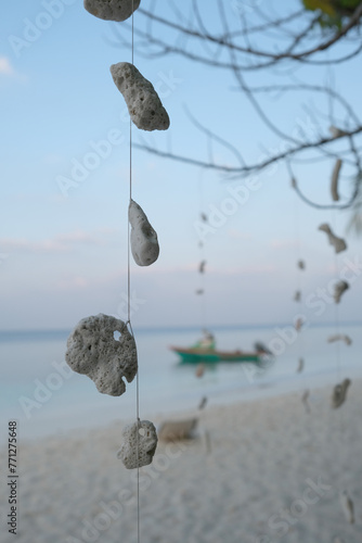 The local villager using the coral and shell as a wind chimes at Ukulhas, Maldives.