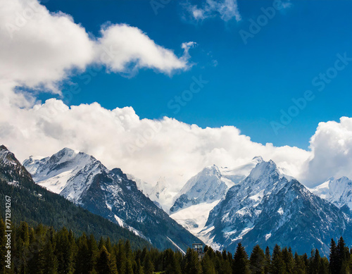 Snowy mountain peaks under a sky panorama.