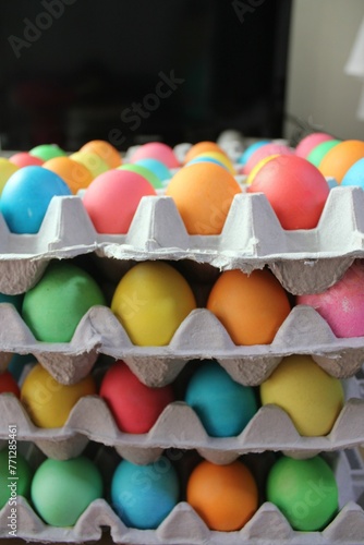 colored eggs in stacked cartons © Chiara Sakuwa
