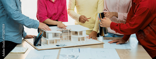 A cropped image of professional interior design team discuss about house material while smart engineer team brainstorm about house construction. Creative working and teamwork concept. Variegated