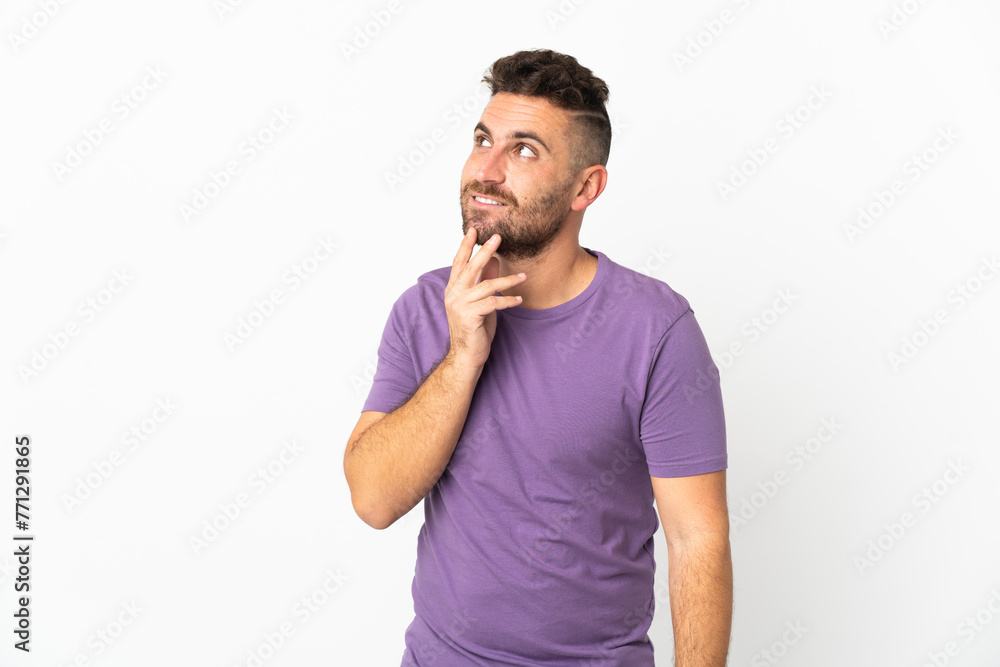 Caucasian man isolated on white background looking up while smiling Caucasian man isolated on white background looking up while smiling