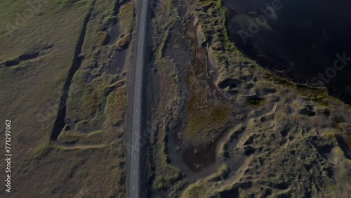 Iceland Drone Shots - 4K. Road 427. Bridge over Hlidarvatn near Reykjanesfolkvangur. Panning upwards to view landscape. photo