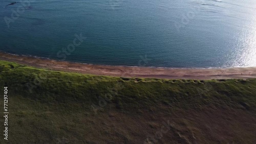 Iceland Drone Shots - 4K. Off the Road 427, opposite Bridge over Hlidarvatn near Reykjanesfolkvangur. Looking out at the sea, waves crashing on beach before the plains. photo