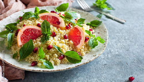 salad couscous with grapefruit and pomegranate seeds. Creative Banner. Copyspace image