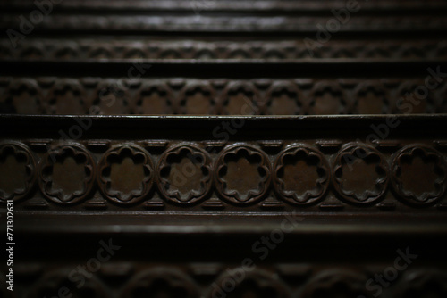 the texture of an old metal staircase in dark tones