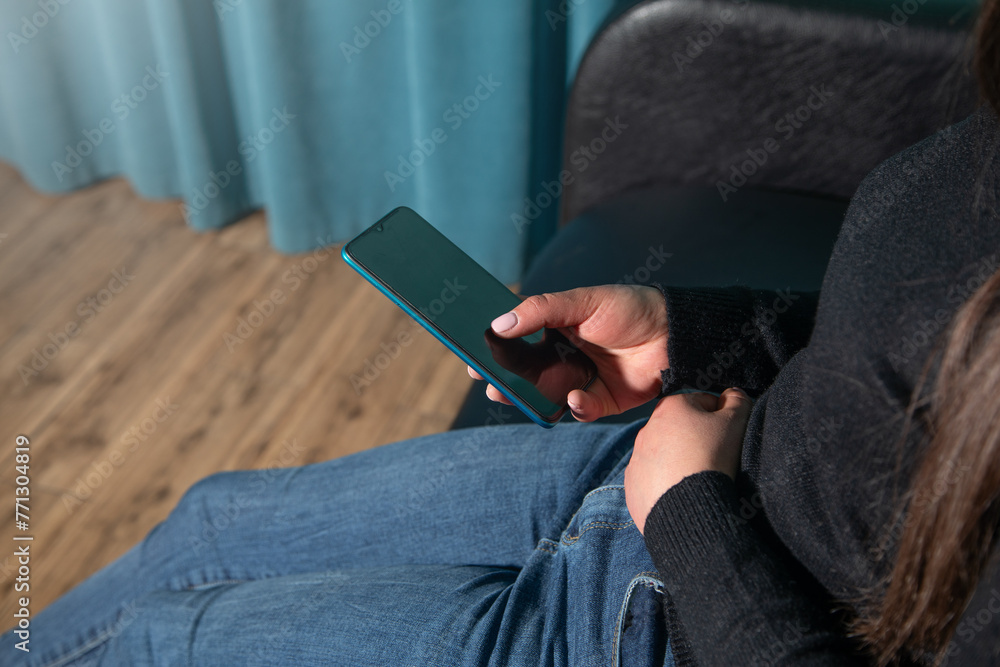 Obraz premium Caucasian woman using mobile phone.