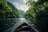 Wooden boat in calm river with green forest and mountain view