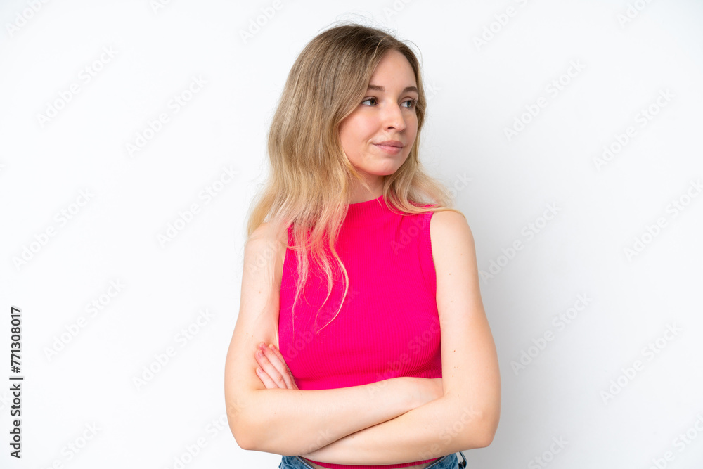 Blonde English young girl isolated on white background keeping the arms crossed Blonde English young girl isolated on white background keeping the arms crossed