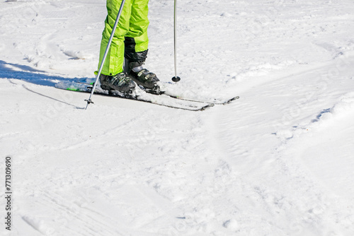 skier on a snowy slope on a sunny day. leisure