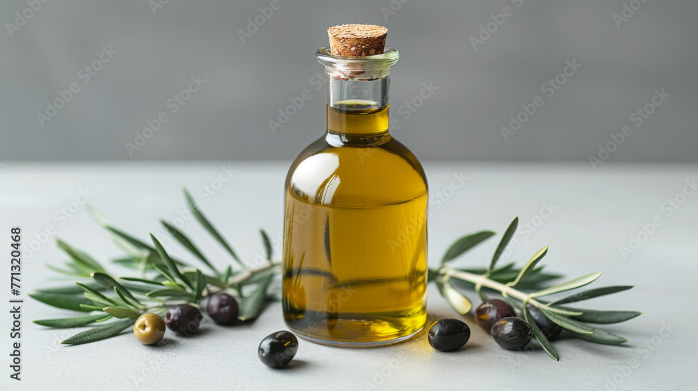 Olive Oil In A Clear Bottle Surrounded By Olives And Green Branches On White Olive Oil In A Clear Bottle Surrounded By Olives And Green Branches On White