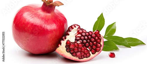 A pomegranate fruit sliced ...