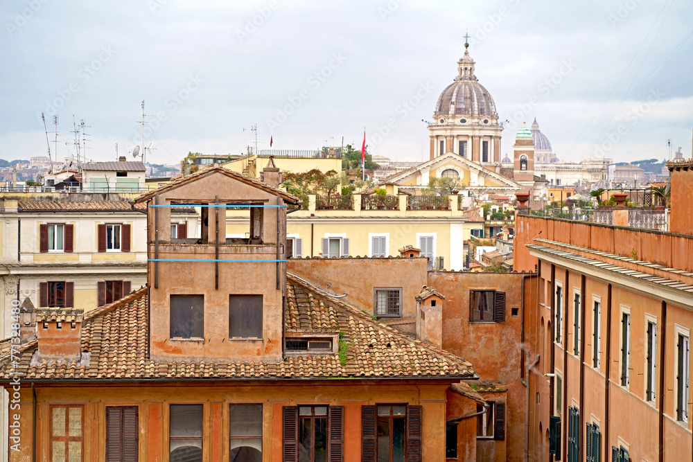 Obraz premium Windows of Rome. Classic old wooden windows with shutters in a public place on a city street or in an urban environment.
