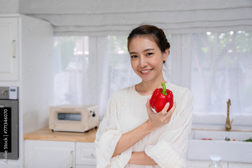 Young woman embraces joyful moments in kitchen. Young woman embraces joyful moments in kitchen.