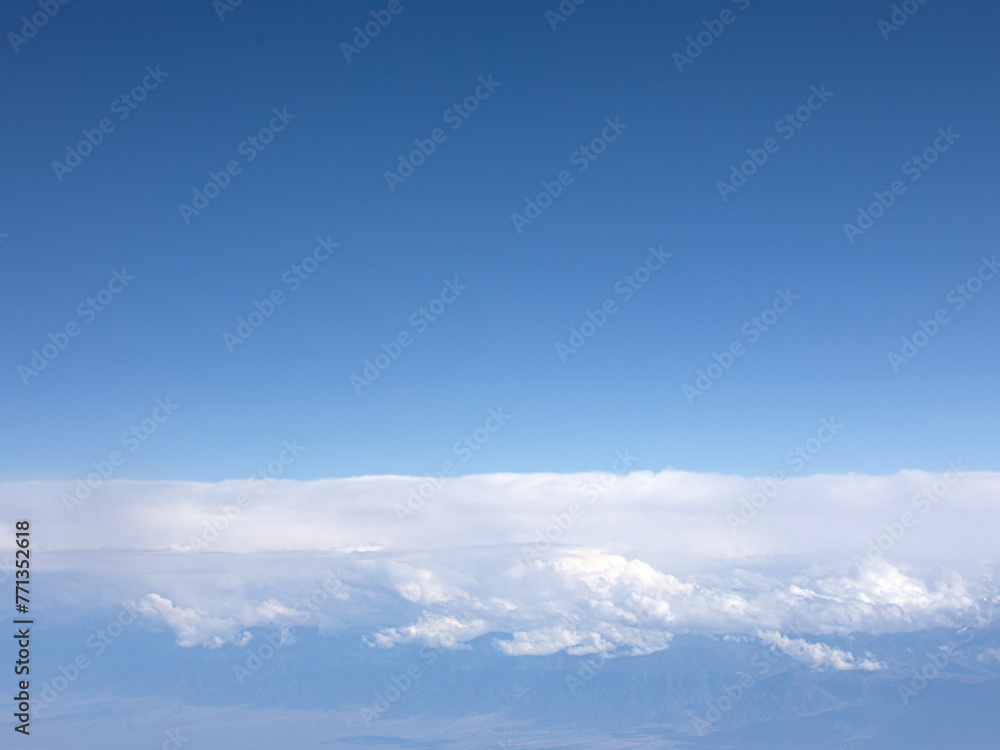 Background view of blue sky and white clouds from an aerial view Background view of blue sky and white clouds from an aerial view