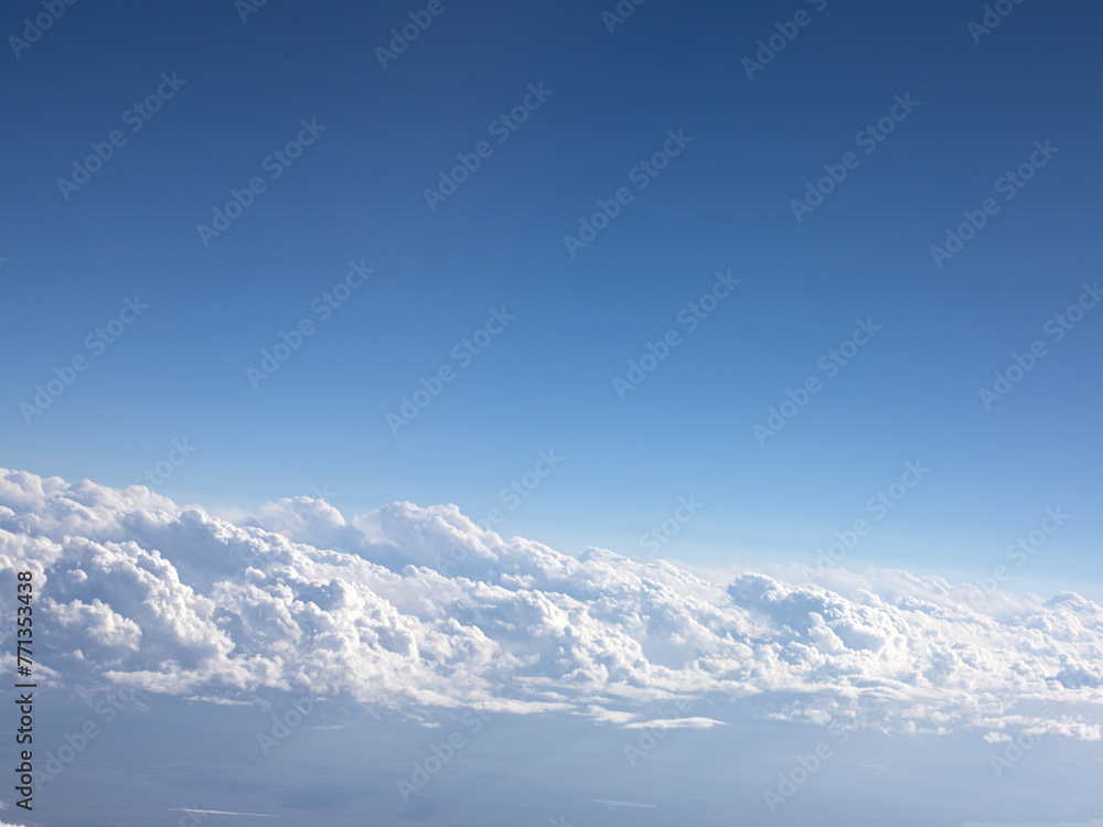 Background view of blue sky and white clouds from an aerial view