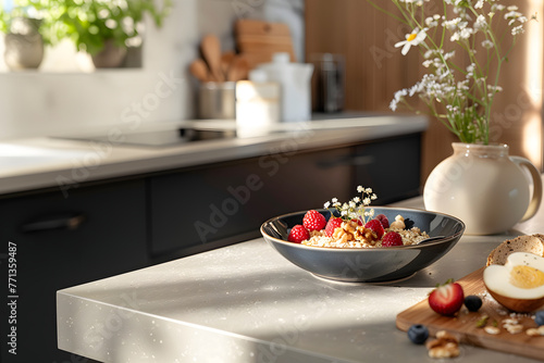 a plate of homemade oatmeal with berries and nuts stands on the table in the kitchen, hot and healthy food for breakfast, a plate of porridge stands on the table in the kitchen with a modern design